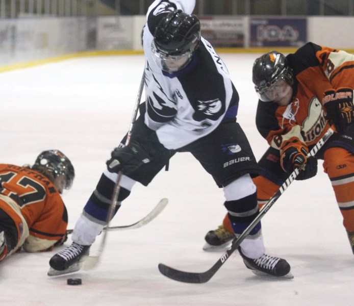 Cold Lake Ice captain Dallas Ansell battles for the puck off a faceoff in Game 1 of the NEAJBHL championship series in Wainwright. The Ice went on to win the game 3-1.