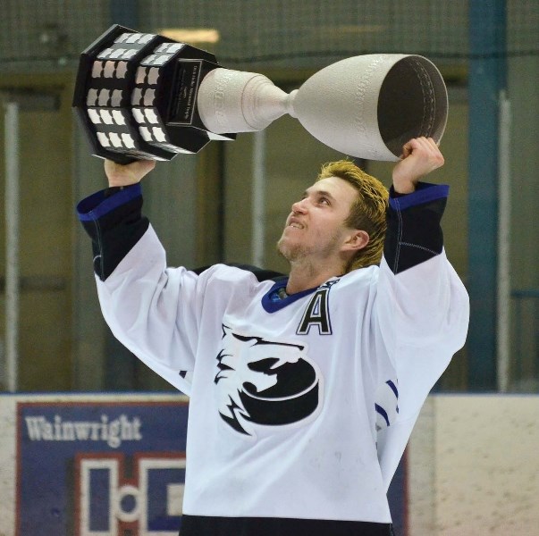 Cold Lake Ice forward Christian Nypower lifts the Dick Holler Memorial Trophy after a 3-2 game 6 win over Wainwright last Friday. The championship is Cold Lake&#8217;s fourth 