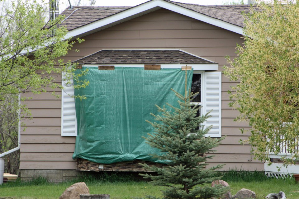 Damage to a home in Glendon where a woman was charged with first degree murder in the death of 44-year-old Kevin Feland.
