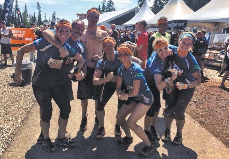 (From left) Viv Lamothe, Larry Lamothe, Dennis Paul, Ashten Haraba, Renee Lamothe, Becky Paul and Cathrin Lohstraeter pose for a photo afater completing Tough Mudder 2014 in