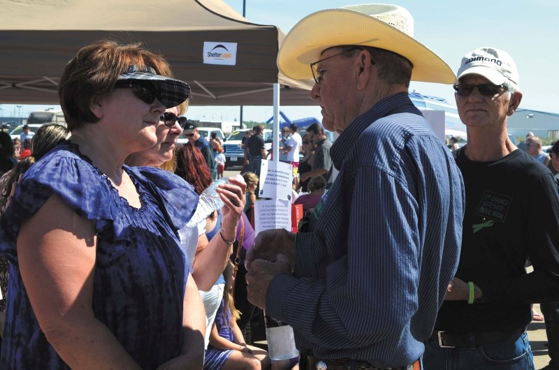 Doris Landry, Brodie&#8217;s grandmother, talks to organ recipients Morris Irvine and Tom Mathews at the charity barbecue and silent action for Brodie Landry last Wednesday