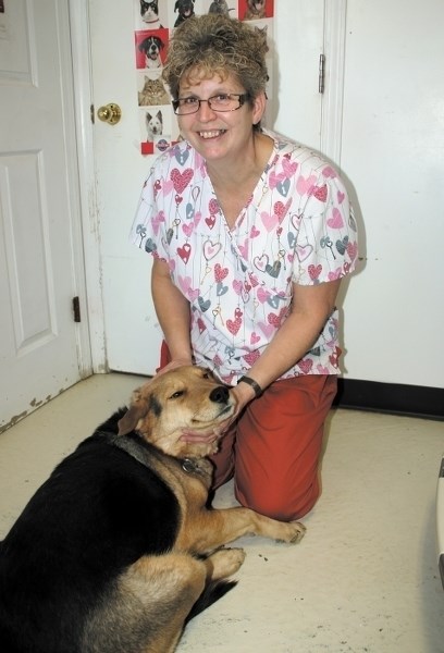 Bonnyville SPCA Manager Heather Mutch with Mavis, one of the adoptable dogs at the shelter.