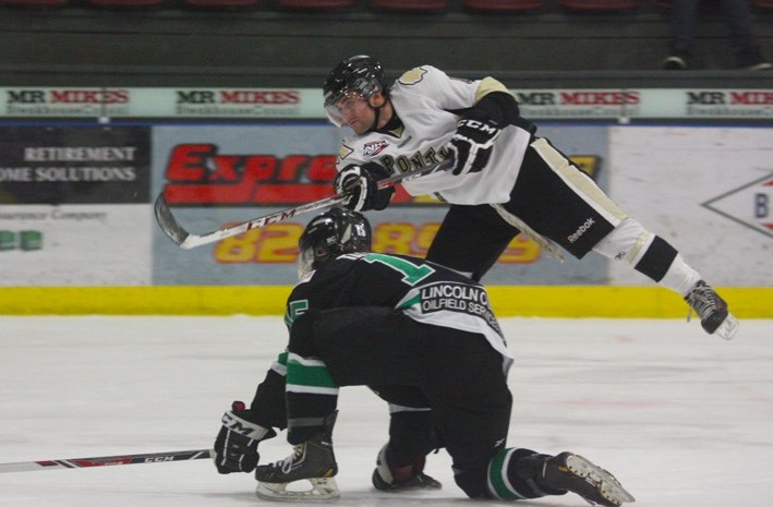Bonnyville forward Luke Mahura takes a shot on goal during Sunday afternoon action against Drayton Valley.
