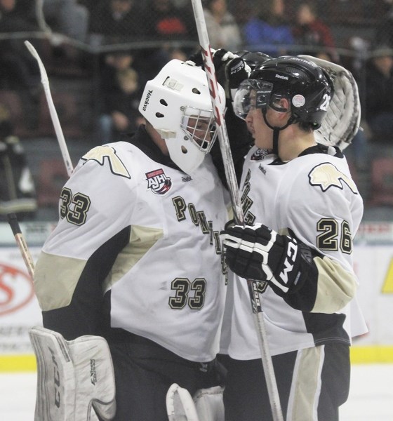 Kyler Hehn celebreates a win with goaltender Ried Kilburn