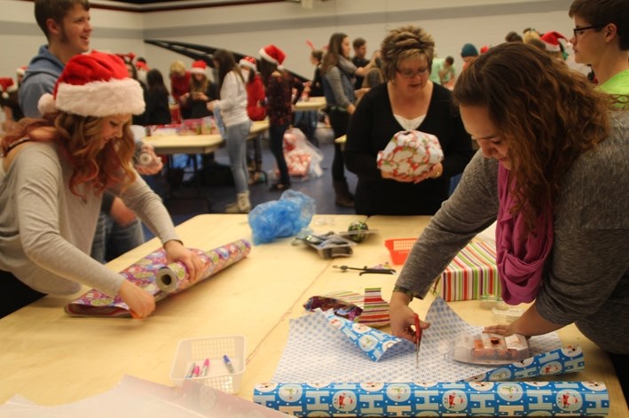 Hundreds of people packed into the BCHS gym last week to wrap gifts.