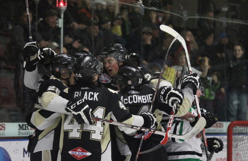 Bonnyville&#8217;s Evan Warmington battles with Drayton Valley&#8217;s Jeff Rose during Game 1 of their first round series. The Pontiacs swept the Thunder in three games.