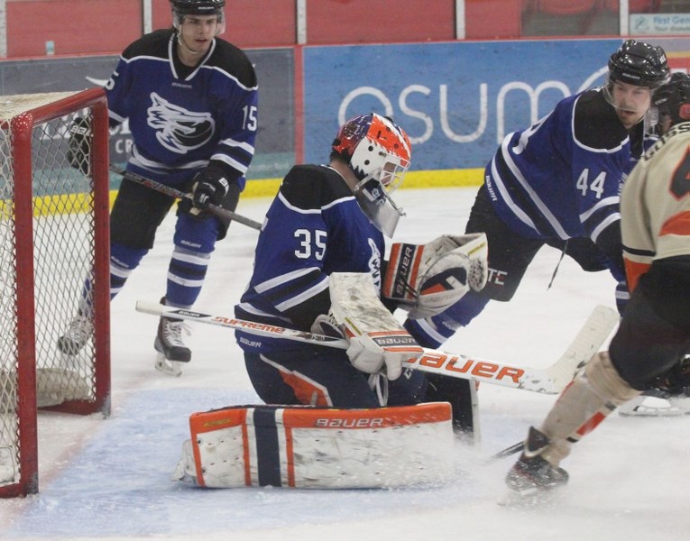 Cold Lake Ice goaltender Bolton Pouliot makes a save during Game 4 against the Wainwright Bisons on Saturday night.