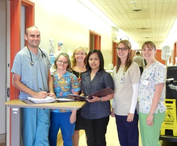 Local phyician Travis Webster (left) was instrumental in implementing a new program at the Bonnyville Covenant Health Centre. The program was recently recognized with an