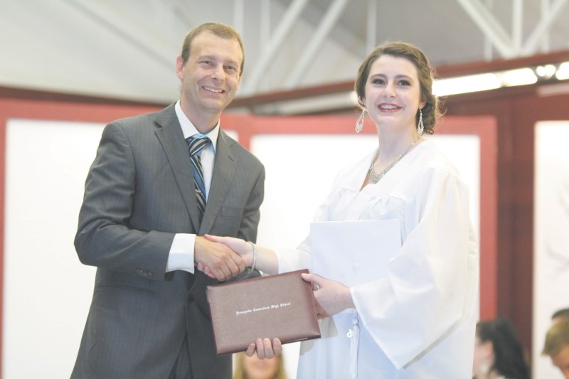 BCHS graduate Chantal Baker recieves her diploma from school Principal Corey Baker.