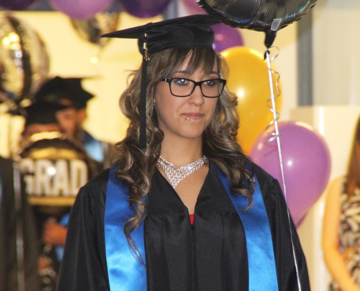 Bonnyville Outreach grad Katya Brown leads the graduates to the stage.