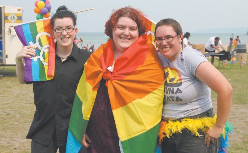 Nicole Dubeau (left), Kelsey Seamons (middle) and Katelynn Plane (right) wear the LGBTQ colours with pride.