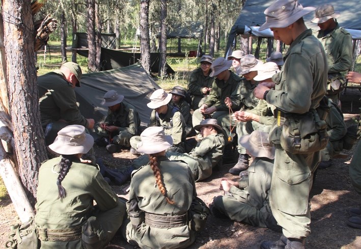 A group of cadets learn how to tie knots. These cadets are part of the more experinced students currently participating in the six week long survival instructors course at