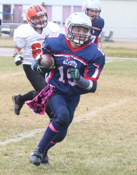 Bandits Mason Ward carries the ball upfield during a playoff game against St. Paul on Saturday afternoon.