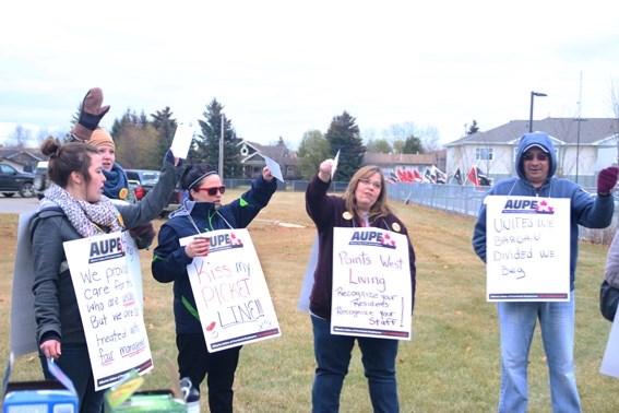 Staff at Points West Living in Cold Lake picketed last month; they have been struggling to get their first contract as a union signed.
