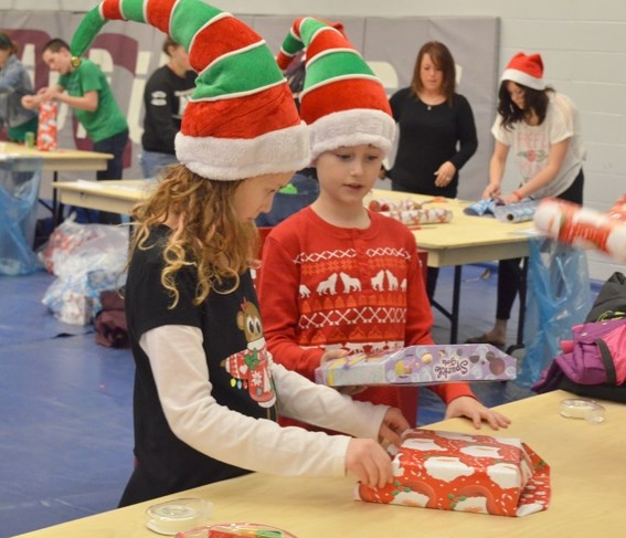 The BCHS Santa&#8217;s Elves wrapped approximately 2,000 girls last week and handed them out to 461 local children.