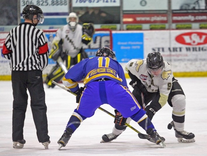 Pontiacs centre Bobby McMann scrums a faceoff against Lloydminsters Morgan Messenger on Friday night in Lloydminster.