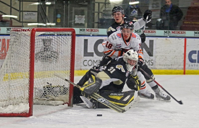 Olivier Charest scrambles after a loose puck in the crease during AJHL action on Feb. 3.