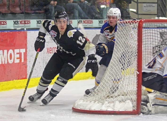 Pontiacs forward Ryan Piche carries the puck behind the goal during third period action against Fort McMurray on Feb. 19.