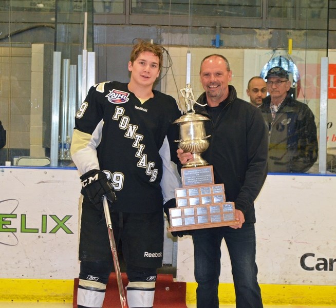 Brinson Pasichnuk was awared his trophy on Friday night after being named the AJHL&#8217;s top defenceman.