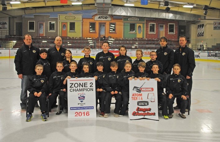 The Bonnyville Atom Pontiacs pose with the championship banners after winning Zone 2 last month. The team has now earned a spot in provincials instead of just taking the host 