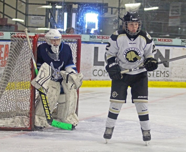 Brent Hoshowski screens the Canmore Eagles netminder during a game on Friday morning.