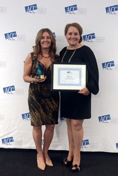 The Cold Lake Regional Chamber of Commerce received their third Chamber of the Year. Sherri Bohme, executive director for the local chamber, accepts the award from Shawna