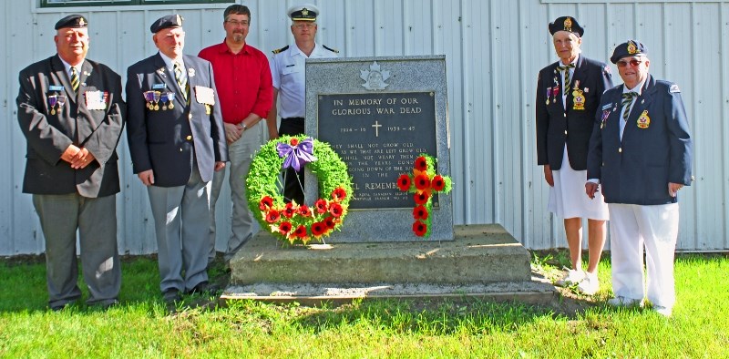 Legion Branch President Dan Gates, Hall Manager Duane Hite, Mayor Gene Sobolewski, Lt. (N) Bob McRae, Ladies Auxiliary President Roberta Daniels and Ladies Auxiliary member