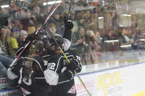 Bonnyville pontiac players celebrate after scoring in the second period of Friday&#8217;s home opener.