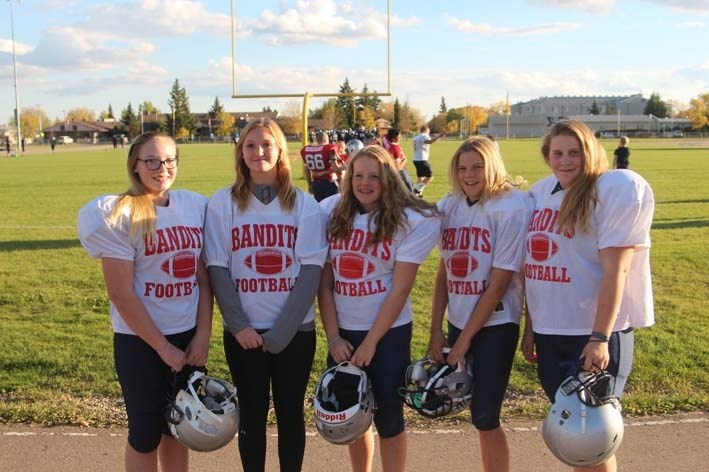 (left to right) Sera Barker-House, Payge Satek, Ariana Church, Alese Sartain, and Cassie Christians all play on the Bonnyville Bandits football team.