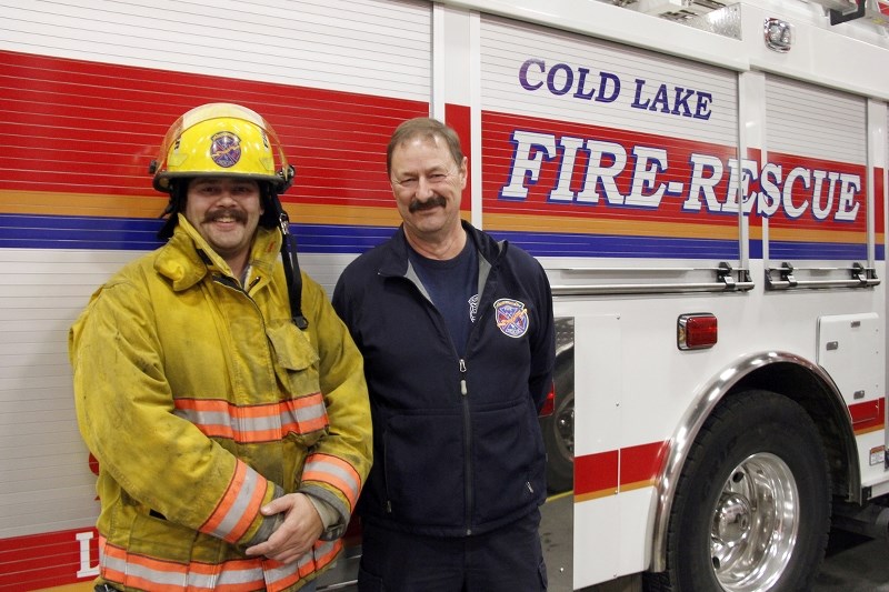 Rodney Hollis (left) joined Cold Lake Fire-Rescue to follow in the footsteps of his dad, Deputy Fire Chief Norm Hollis (right).