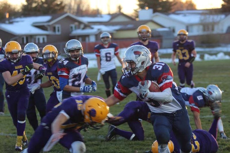 Reid Skrypichayko is chased down field for a gian in Fridays loss to the Lloyd Comp. Barons.