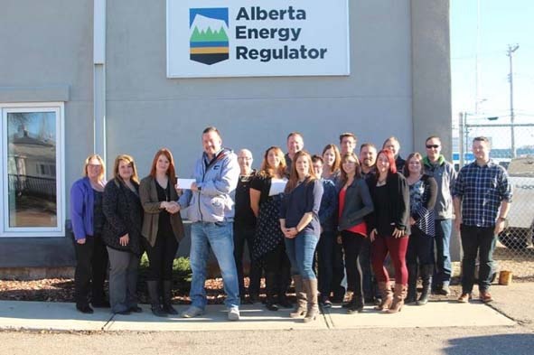 Members of the DMSCC along with the staff of the Alberta Energy Regulators office pose for a photo after a cheque presentation. The funds will be used for the Bonnyville