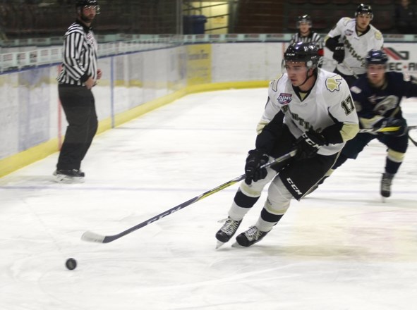 Mitch Oliver skates down the ice with the puck during the Pontiacs game against the Pruce Grove Saints on Tuesday, Nov. 15, at the RJ Lalonde Arena.