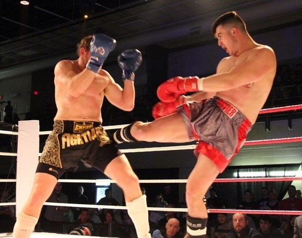 Michael Janvier of Cold Lake gives a swift kick to Calgary fighter Jason Gorzo during the final K1 Kickboxing match of the Dekada Premier Fight Night on Saturday, Nov. 12.