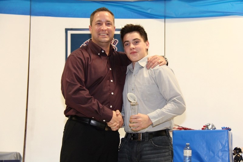 Duncan Critch accepts the Renegades Heart and Soul Award on Saturday night at the team&#8217;s year end banquet. This season was the last for both head coach Kevin Sartain