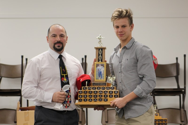Silas Fagnan received the 2016 Offensive player of the Year award from coach Larry Godziuk. Fagna set a Voyageurs record with 1520 passing yards this season.