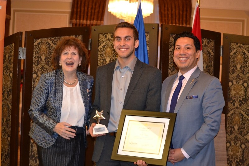 Dallas Ansell (centre) was presented with the award by Lieutenant Governor Lois Mitchell (left) and the Minister of Alberta Culture and Tourism Ricardo Miranda.