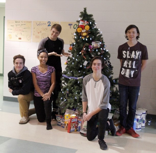 Grade 10 Assumption School students are collecting donations for the Lakeland Humane Society through their Crusaders for Critters campaign. Left to right: Jasin Saindon,