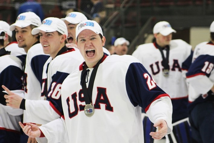 Zach Solow celebrate&#8217;s team USA&#8217;s gold medal victory over Canada East in the World Junior A Challenge on Saturday, Dec. 17.