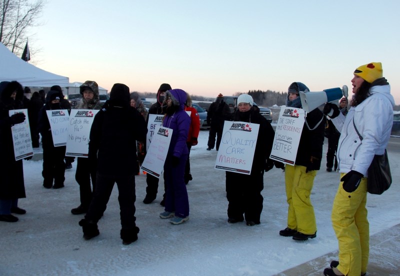 Points West Living healthcare aids and AUPE representatives hold a demonstration outside of Points West Living in Cold Lake after being locked out.