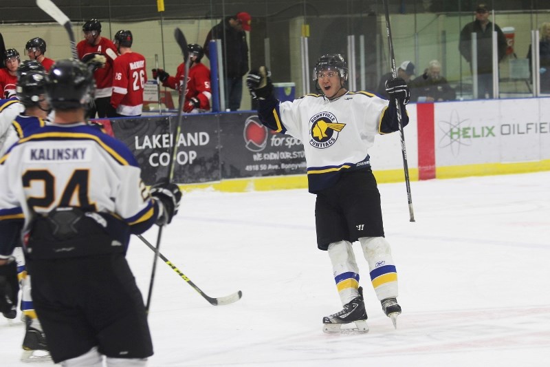 Troy Dumais celebrates his overtime goal in Saturdays game against the Eckville Eagles.