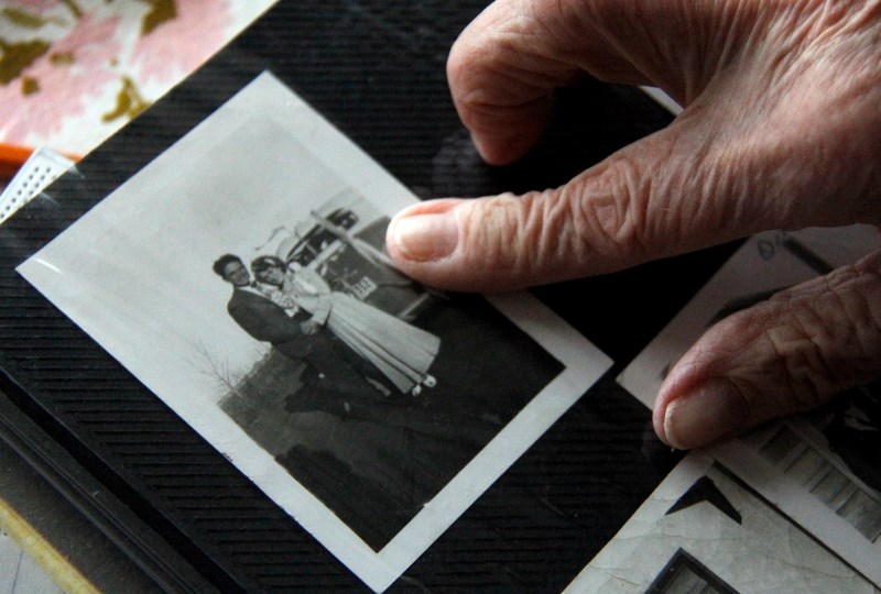 Julia points to an old photograph of the couple before they were married.