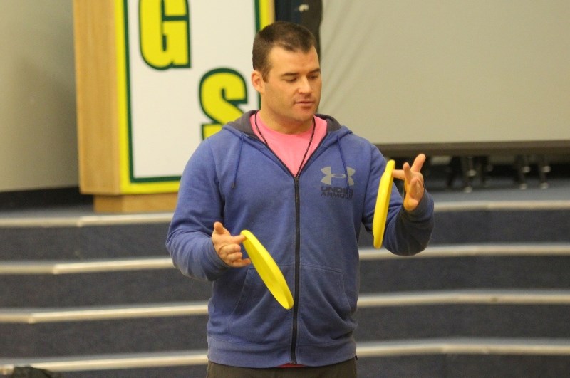 Rob McLeod speaks to students at Glendon School about the joys of playing with a frisbee.