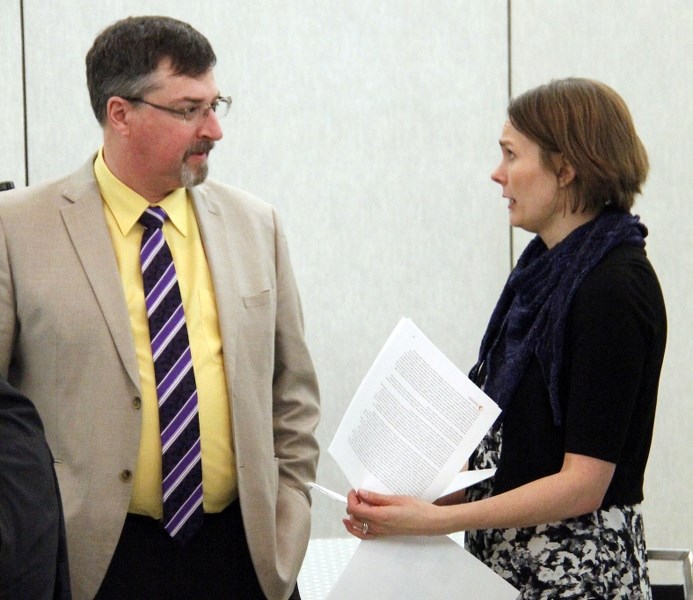 Bonnyville Mayor Gene Sobolewski discusses the Cold Lake Health Assessment study with Stantec aquatic biologist Karoliina Munter.