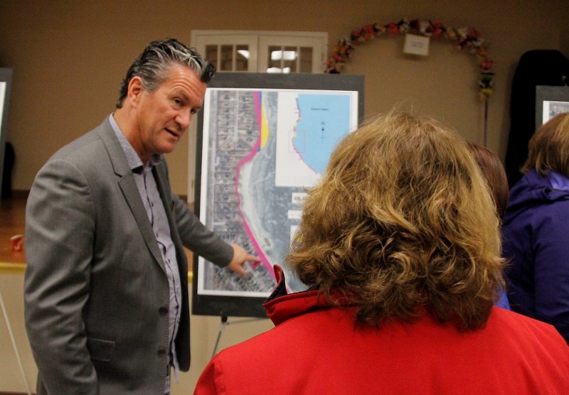 City of Cold Lake Mayor Craig Copeland discusses the issue of encroaching on Crown land on Cold Lake with a resident at the lakeshore open house last week.
