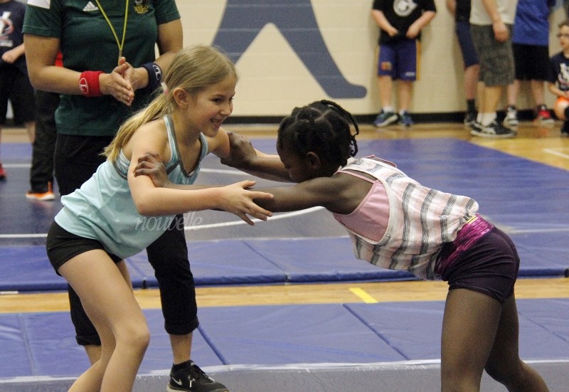 Joda Amyotte and Alima Coulibaly go head-to-head on the wrestling mat.
