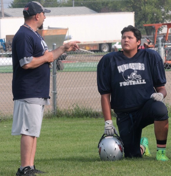 Navarone Watchmaker listens intently to instruction from Voyageurs head coach Larry Godziuk. Watchmaker will be joining the Western Canada U16 All-Stars team in Texas.