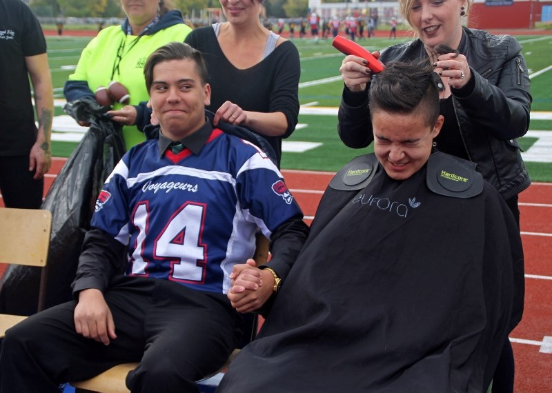 Members of the Bonnyville Voyageurs, Bandits, and Renegades said goodbye to their hair during the Scott MacDonald Memorial head shave on Saturday, Sept. 16. In this photo,
