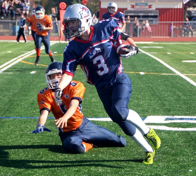 Kelton McAuley carries the ball for the Bandits during their home-game win over the Lloydminster Mustangs on Saturday, Sept. 30.