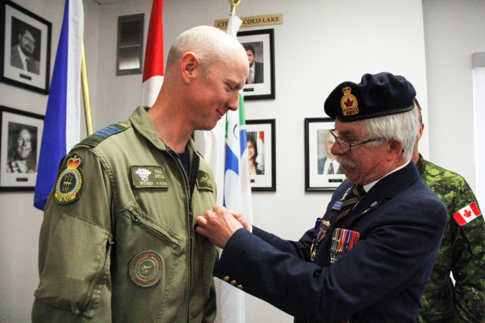 4 Wing Commander Col. Paul Doyle was the first to receive a poppy for the Cold Lake Poppy Campaign. He accepted the honour from Pat Henderson, second vice-president for the